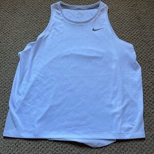 Woman’s Nike never been worn, with tags, brand new white tank top!
